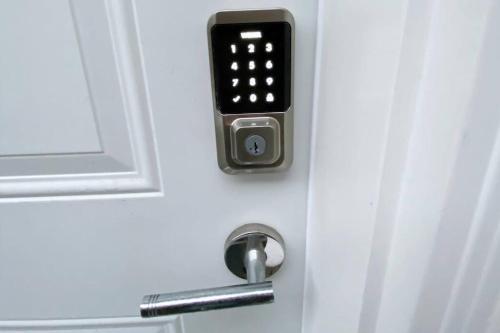 a door with an apple watch attached to it at Two Bedroom Suite Burnaby Metrotown in Burnaby