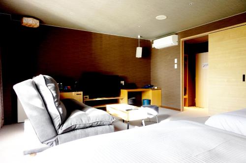 Postel nebo postele na pokoji v ubytování Resort Hotel RAKI House Nasu