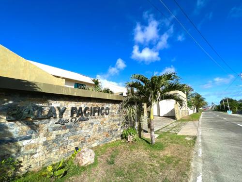 a wall with graffiti on it next to a street at Balay Pacifico in Sarog