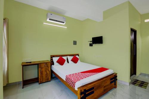 Gulta vai gultas numurā naktsmītnē OYO Prasanth Holiday Inn