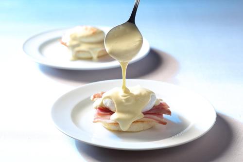 a spoon is drizzling peanut butter on a pastry at ANA Crowne Plaza Narita by IHG in Narita
