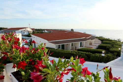 a view from the balcony of a house with flowers at Acqua di Mare Hotel e Resort in Sorso