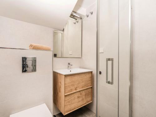 a small bathroom with a sink and a shower at Casa Buena Vista in Teulada