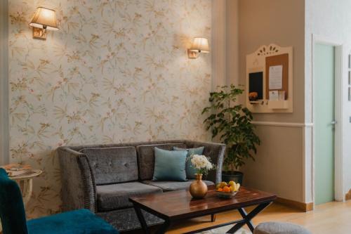 a living room with a couch and a table at Karma Chalets in Gurgaon