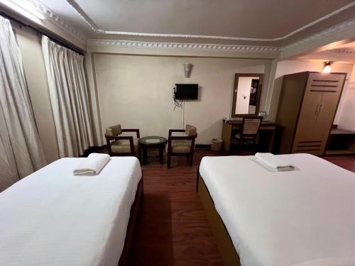 Cama o camas de una habitación en Taleju Grand Hotel