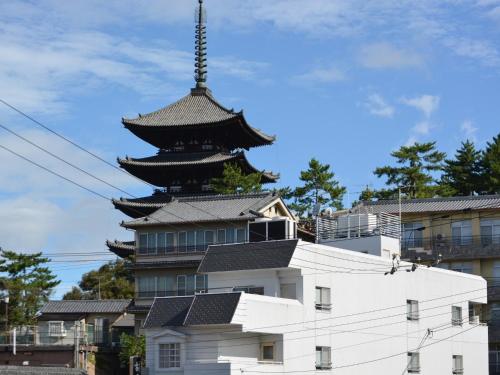 a large building with a pagoda on top of it at Nara - Hotel / Vacation STAY 47950 in Nara