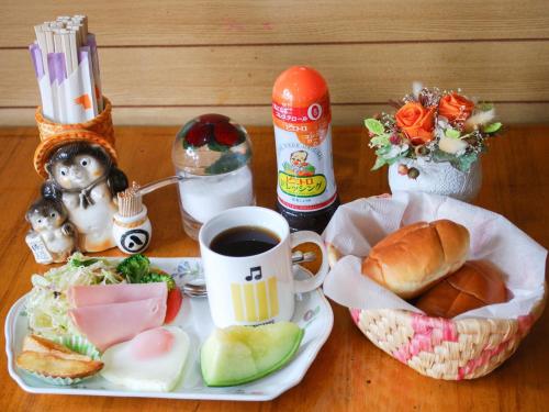 a table with a plate of food and a cup of coffee at Nara - Hotel / Vacation STAY 47950 in Nara