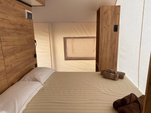 a bedroom with a bed with a teddy bear on it at Agriturismo Casa del Principe in Torre Bormida