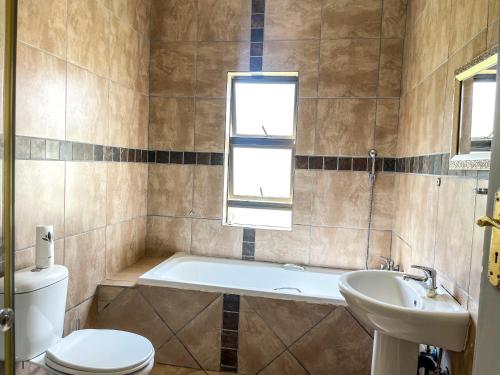 Ένα μπάνιο στο Bobisemo Lux Guesthouse