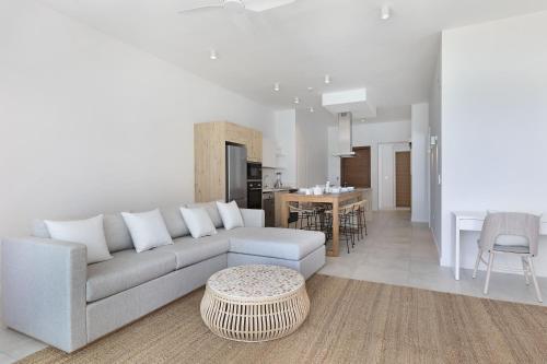 a living room with a couch and a table at Ocean Grand Gaube by Host Agents in Grand Gaube