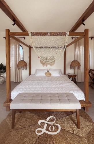 a bedroom with a bed with a net at Lo Villa - Venuestay in Phu Yen