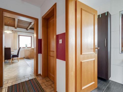 a hallway with a door and a dining room at Beautiful holiday home in Viechtach with views in Viechtach