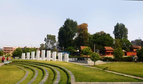 a park with a large amphitheater in the grass at Om Kedareshwar Boys Hostel in Kathmandu