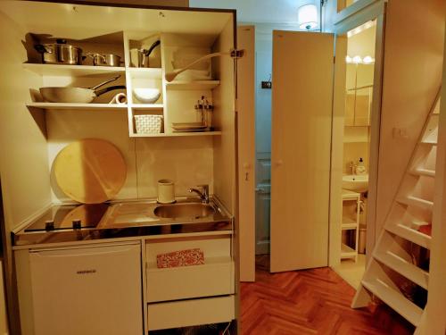 Kuchyň nebo kuchyňský kout v ubytování Isola Studio Rosa