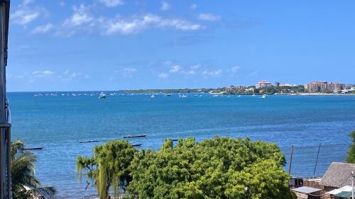 a view of a large body of water with boats at Ocean view Home stay in Dar es Salaam