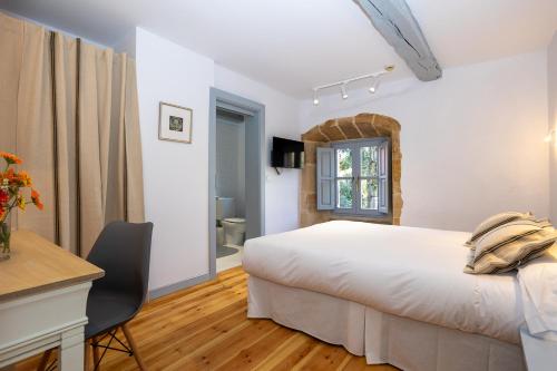 Ένα ή περισσότερα κρεβάτια σε δωμάτιο στο Casona Las Cinco Calderas