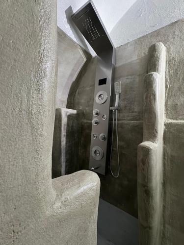 a bathroom with a shower in a building at Cueva Con Vista Studios in Pirgos