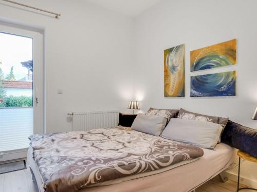 a bedroom with a large bed in front of a window at Spacious Apartment in Madfeld with Private Terrace in Madfeld