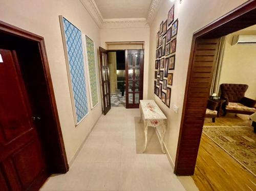 a hallway of a house with a room with a couch at Shelton Hotel Mardan in Mardan