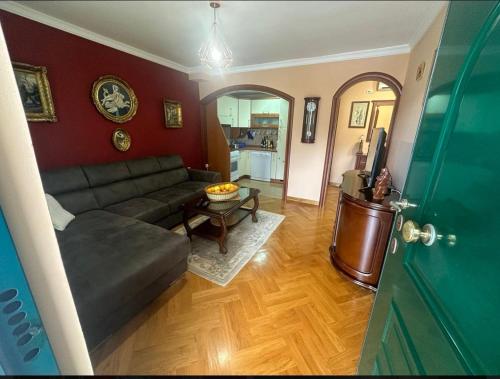 a living room with a couch and a table at Apartman Maja in Sveti Stefan