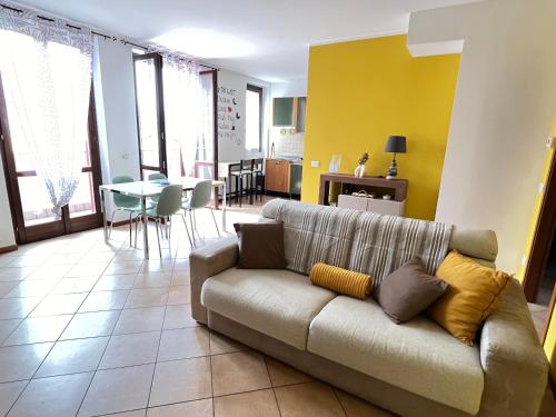 a living room with a couch and a table at Lake and River Feelings - Dervio Apartment in Dervio