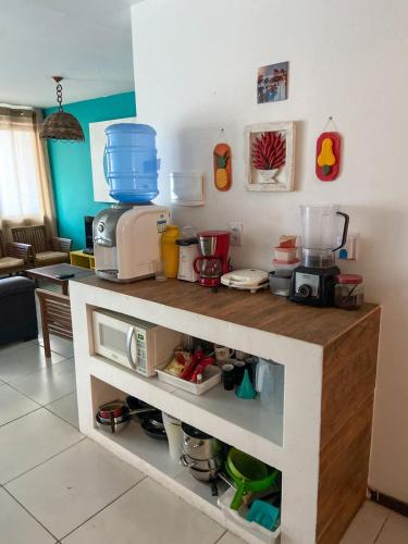 a kitchen with a counter with a coffee maker on it at Casa Macao Pipa in Pipa