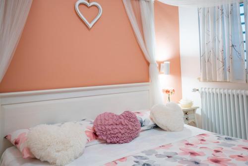 Giường trong phòng chung tại Petali Rosa - Dimora Peonia