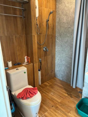 a bathroom with a toilet with a shower in it at Phuket naka condon-52-45 免费高速上网免费停车 in Phuket