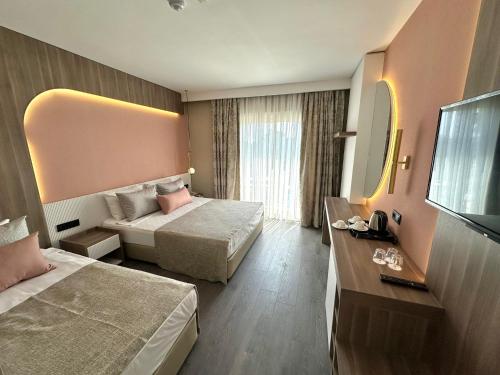 Postel nebo postele na pokoji v ubytování L'Oceanica Beach Resort