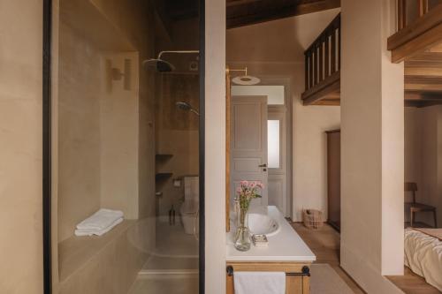 a bathroom with a sink and a shower and a toilet at Casa Tao in Athens