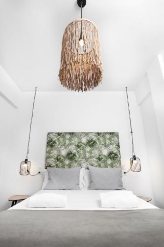 Ένα ή περισσότερα κρεβάτια σε δωμάτιο στο Apartamentos Isabella by Concept Flats