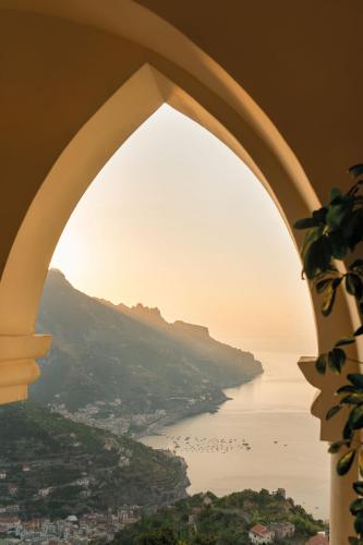 a view of the ocean through a window at Caruso, A Belmond Hotel, Amalfi Coast in Ravello