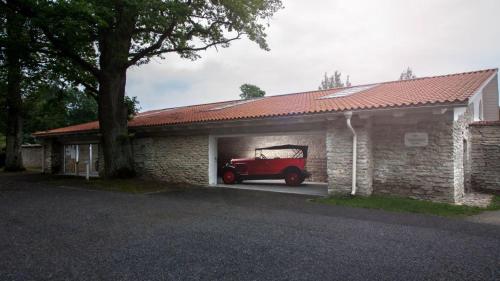 a red car is parked in a garage at Vihula Manor Country Club & Spa in Vihula