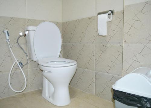 a bathroom with a toilet and a roll of toilet paper at بيت الطبيعة nature house in Jerash