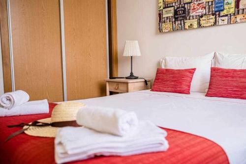 a hotel room with a bed with towels on it at Casa do Rio in Peso da Régua
