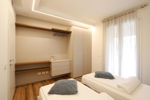 Postel nebo postele na pokoji v ubytování Villa 41 Lazise