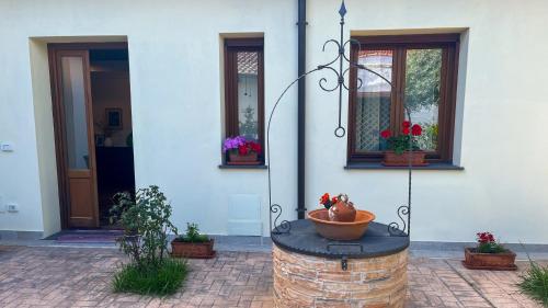 a water fountain in front of a building at Sardinianworld - Domo Mea in Càbras