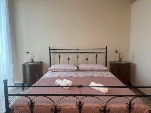 a bedroom with a bed with two towels on it at Residenza Gonzaga in Serracapriola