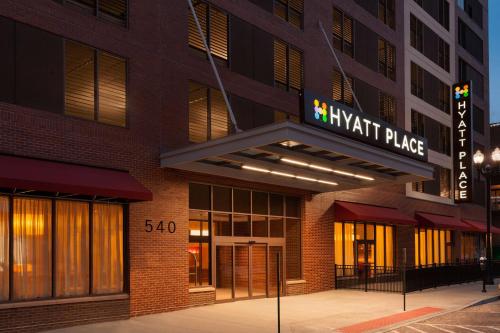 a building with a sign for the knight place at Hyatt Place Omaha/Downtown-Old Market in Omaha