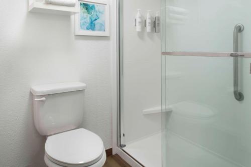 a bathroom with a toilet and a glass shower at Hampton Inn Hilton Head in Hilton Head Island