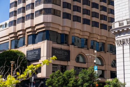 a large building with signs on the side of it at Hilton Parc 55 San Francisco Union Square in San Francisco