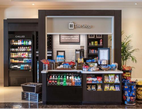 a store with a counter with food and drinks at Hilton Garden Inn Palm Beach Gardens in Palm Beach Gardens