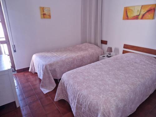 a room with two beds in a room at T2 Alvor Terrace in Alvor