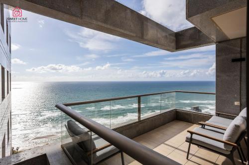 a balcony with a view of the ocean at Luxury apartments' in Netanya in Netanya