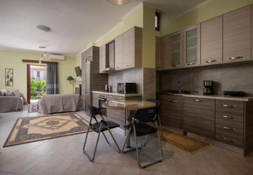 a kitchen with a table and chairs in a room at Pappas Family House in Nafplio