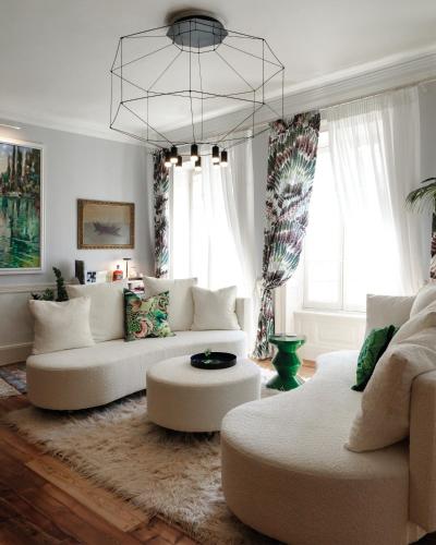 a living room with white furniture and a chandelier at Mimi & Coco Old Corfu Town in Corfu