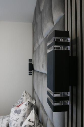 a bedroom with a bed and a wall with a dresser at Hotel Löwenstein in Lich