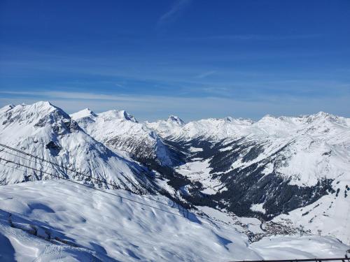 a view of a mountain range with snow at Berghof Ferienhaus in Schröcken