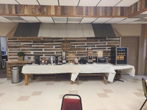 a large table in a room with a counter with at Blue Sky Inn- Complimentary Happy Hour Th-Sun, Veteran owned, Full Breakfast, Best green space, 1 mile from Blue Ridge, Fire Pit in Blue Ridge