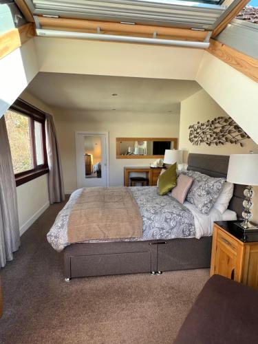 a bedroom with a large bed in a room at Stronchreggan View Guest House in Fort William